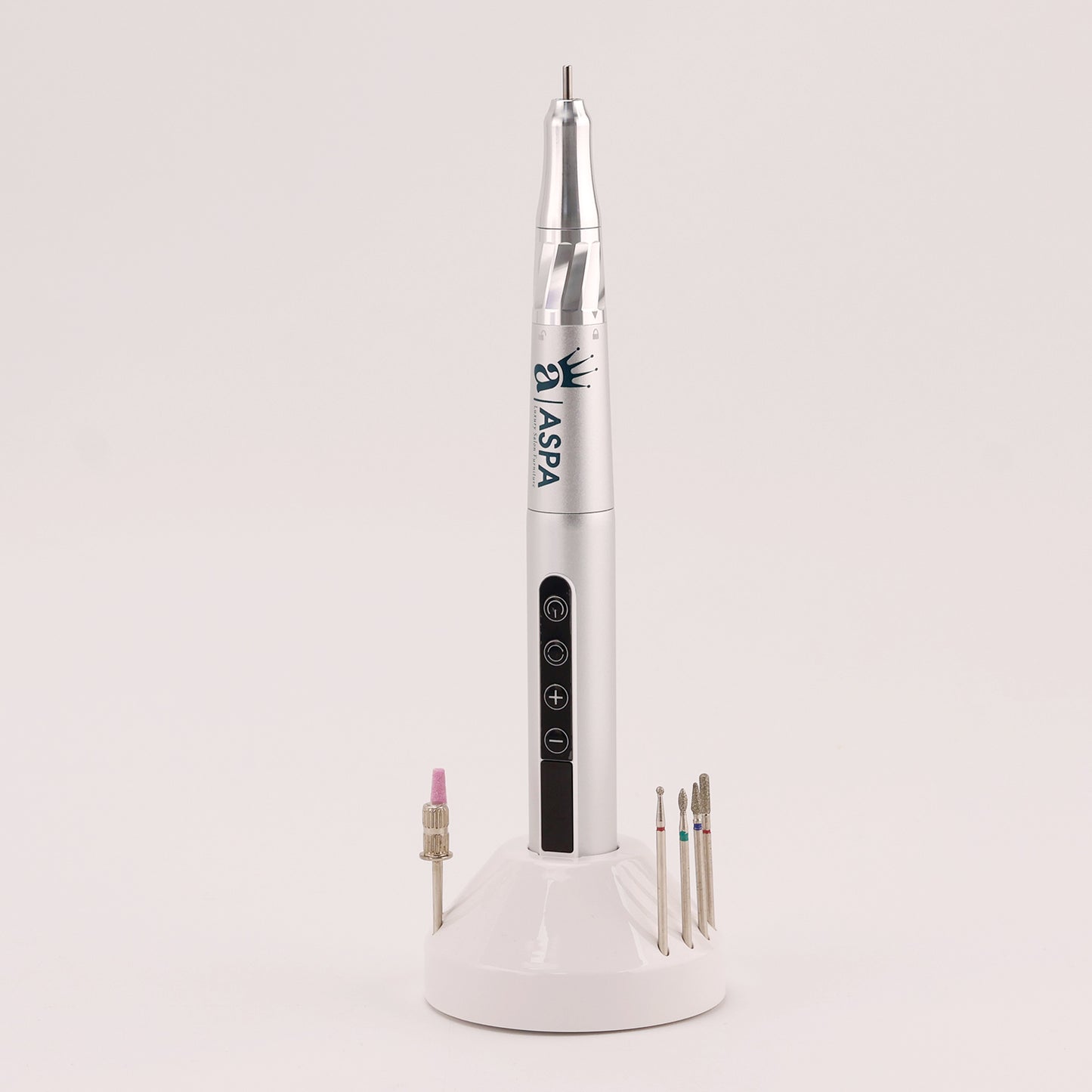 White nail drill tool with attachments on a light gray background