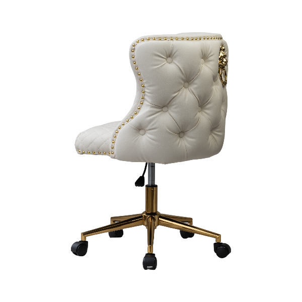 Angled rear view of a white tufted chair with gold nail-head trim, a lion knocker accent, and a gold wheeled base