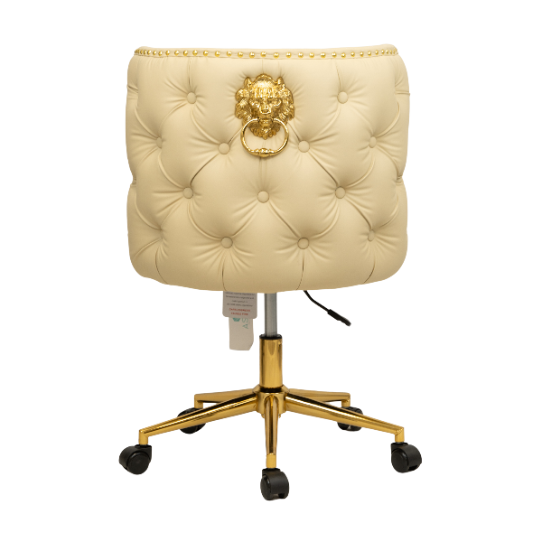 Back view of a cream tufted chair with a gold lion knocker detail and a gold five-star base with caster wheels