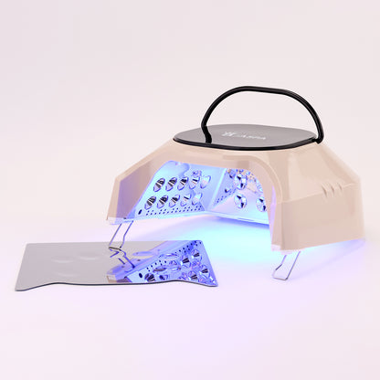 Nail dryer with blue light on a white background
