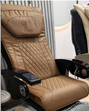 Beige massage chair with quilted design and control panel in a room setting
