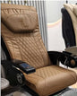 Beige massage chair with quilted design and control panel in a room setting