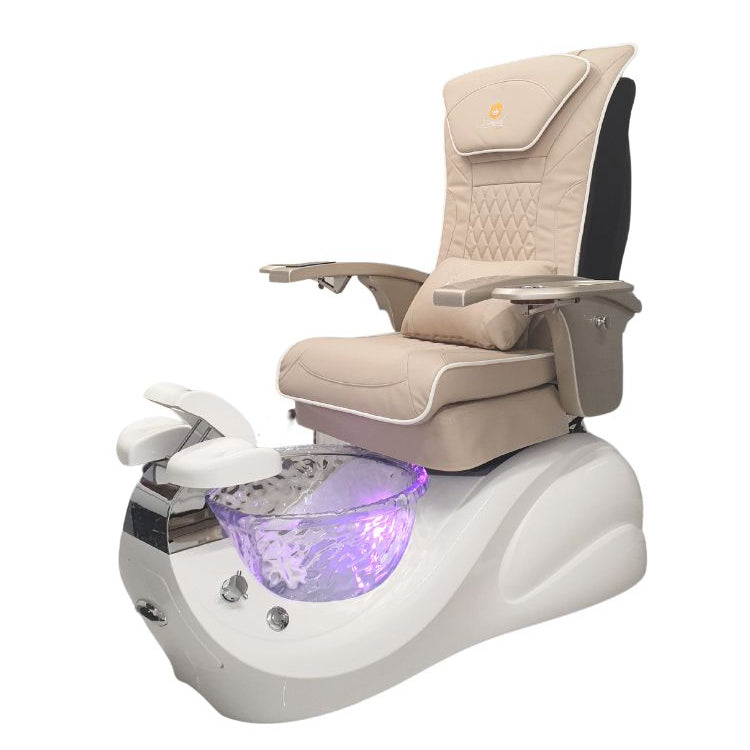 A modern pedicure chair with a white base and gold armrests, featuring a beige seat and backrest with a glass bowl at the footrest section, illuminated by a purple light.
