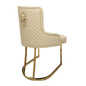 Beige quilted chair with gold accents on a white background