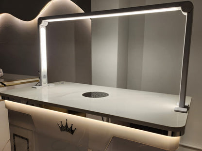 Modern table light with a reflective surface and built-in cooktop.
