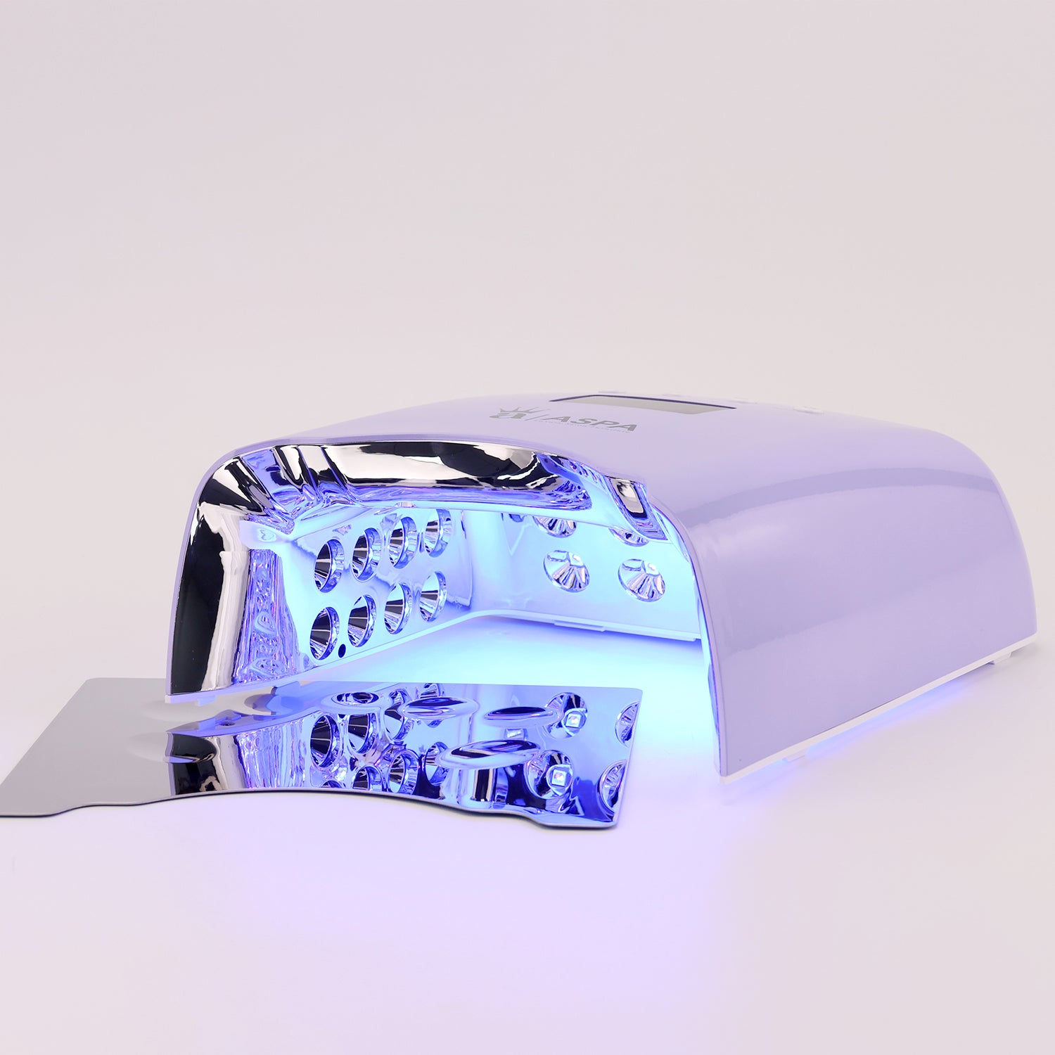 Nail dryer with blue light on a white background