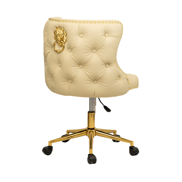 Rear view of a cream tufted chair with a gold lion knocker detail and a gold five-star base with caster wheels