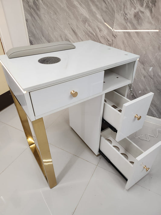 White vanity table with gold legs and drawers in a tiled room.