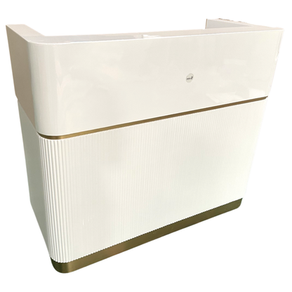 White reception desk with gold trim on a white background