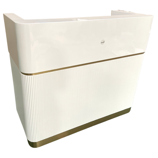 White reception desk with gold trim on a white background