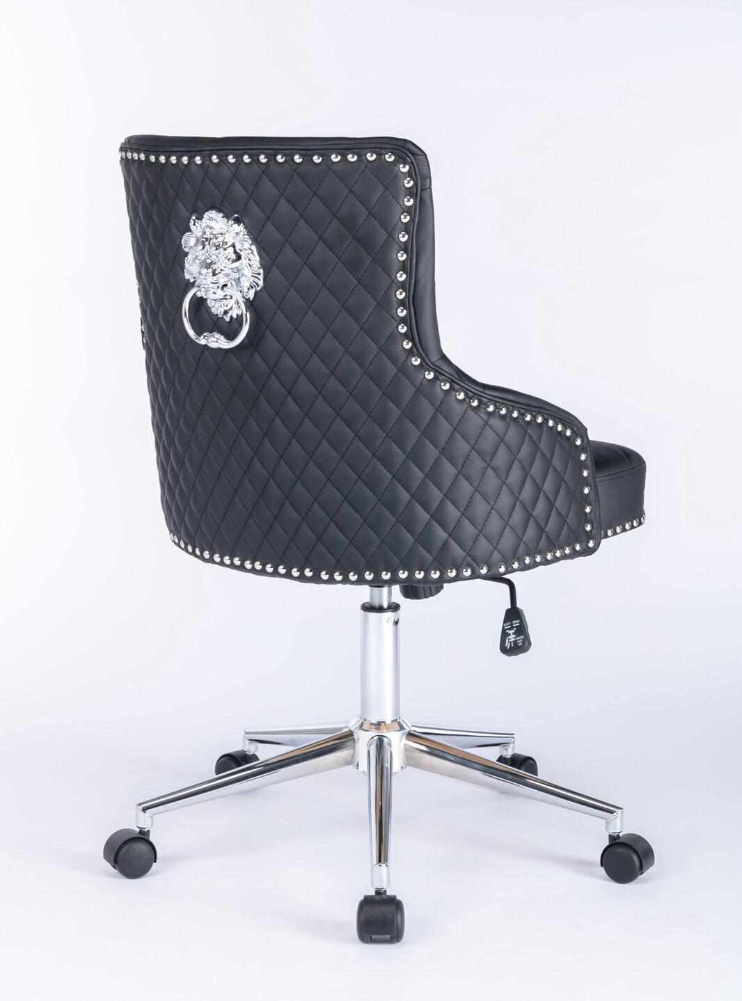 Rear three-quarter view of a black upholstered swivel office chair with diamond-quilted backrest, silver lion head ring pull detail, silver nailhead trim around the edges, and a chrome five-star base with castors and height adjustment lever.