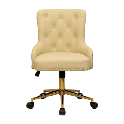 Front view of a beige upholstered swivel office chair with button-tufted backrest, curved padded arms, gold nailhead trim along the seat edge, and a gold five-star base with castors and height adjustment lever.