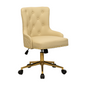 Three-quarter front view of a beige upholstered swivel office chair with button-tufted backrest, curved padded arms, gold nailhead trim along the seat edge, quilted side panels, and a gold five-star base with castors and height adjustment lever.