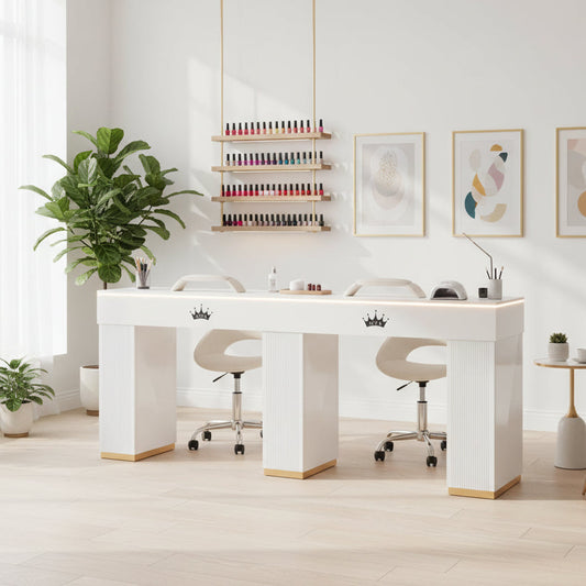 White nail salon table with gold accents and crowns on a white background