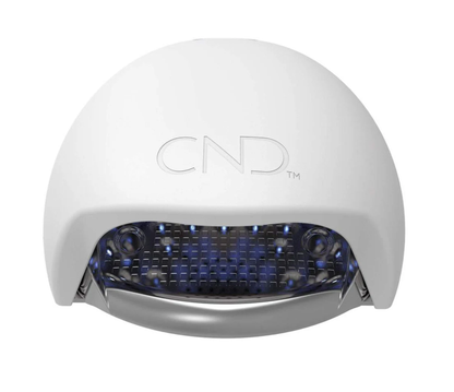 A white CND branded gel lamp with blue light-emitting diodes visible through the front